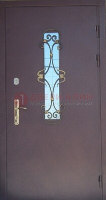 Металлическая дверь со стеклом и ковкой ДСК-77 в Петрозаводске